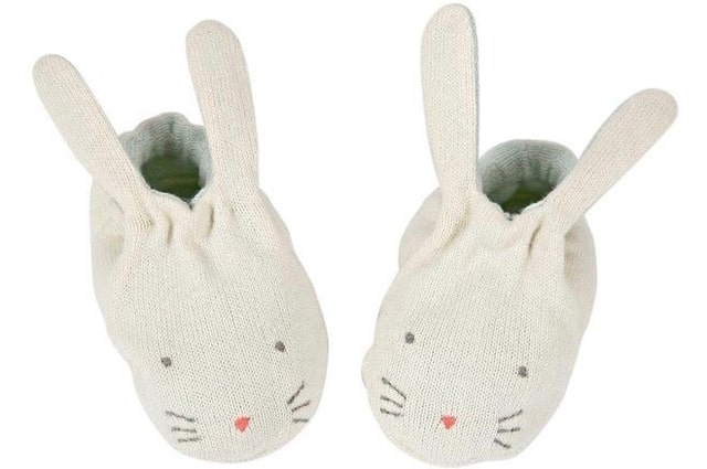 19 of the Best Baby Booties Out There, a pair of white booties with the face and ears of bunnies.